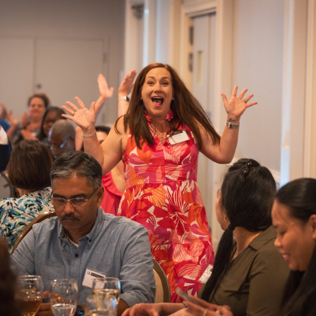Cedar Ridge Elementary Educator April Barbin wins a door prize during the reception. Using SRNS grant funds, Barbin will introduce 3D printing coding concepts in her classroom.